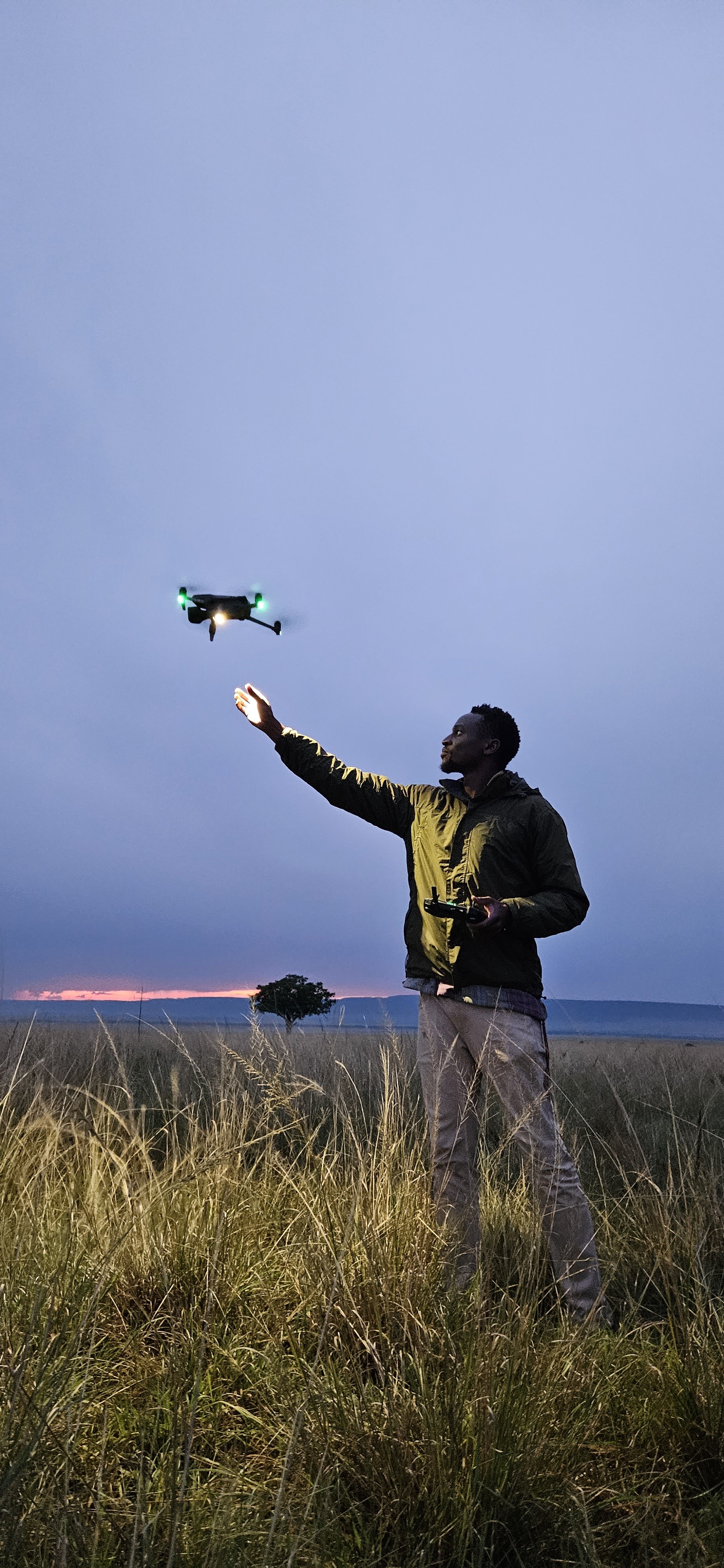 Documentary filmmaker and aerial cinematographer Anthony Njuguna launching his drone into the wild in Kenya