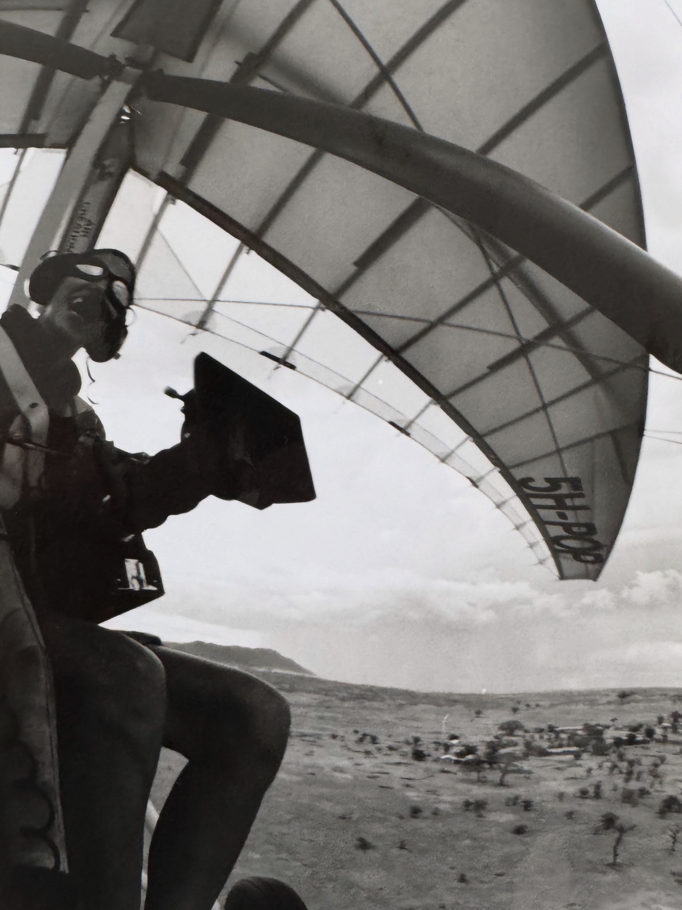 Sophie en route to capture aerial shots for Intimate Enemies: Lion and Buffalo in the late-1990s, from a powered hang glider with an ARRI HSII strapped around her neck with a belt