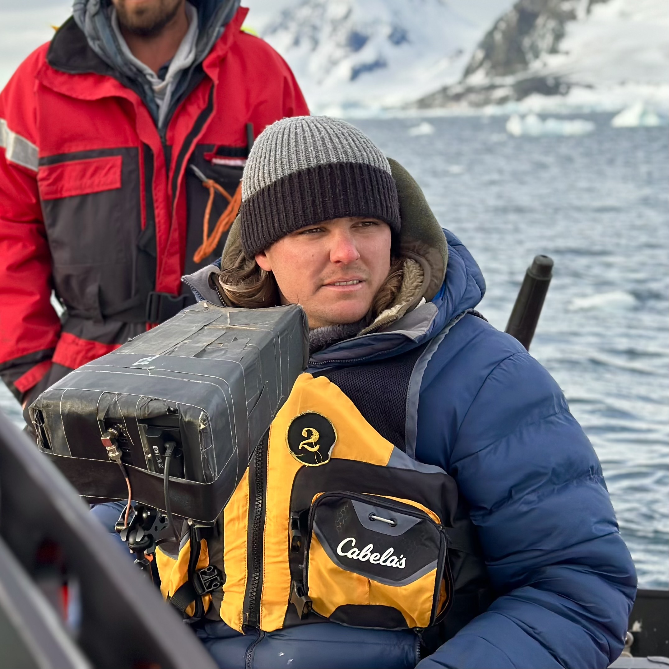 Wildlife filmmaker Tom Walker filming for the BBC's Expedition Killer Whale on location in the Antarctic
